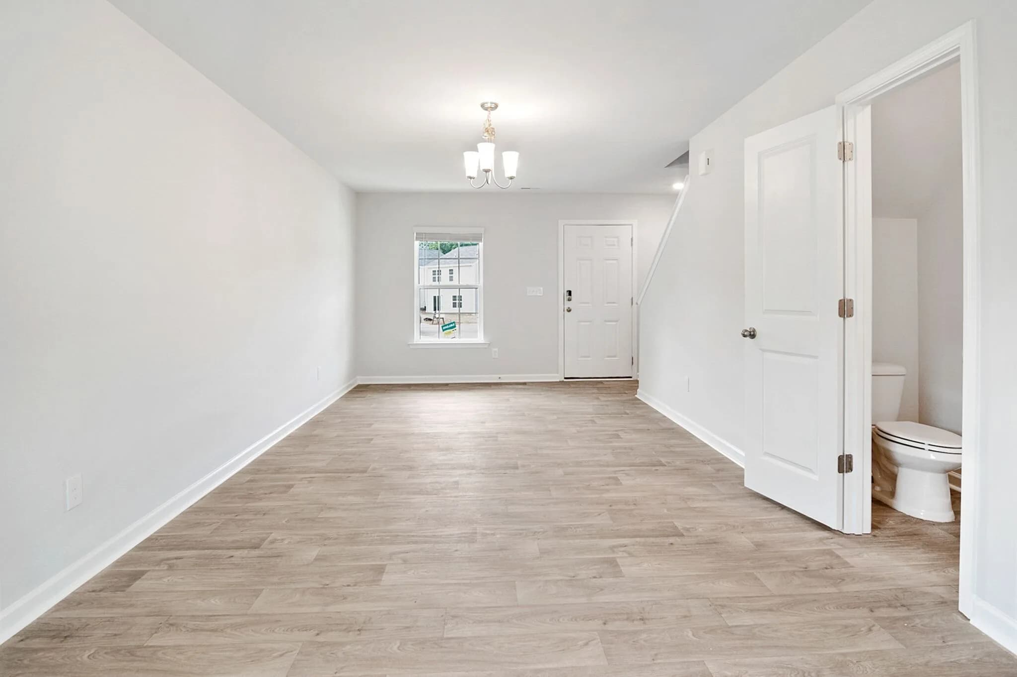 VS-06 Open-plan living and dining room source before virtual staging